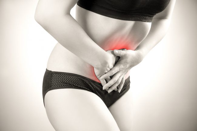 Woman with abdominal pain. Pain in the human body PMS